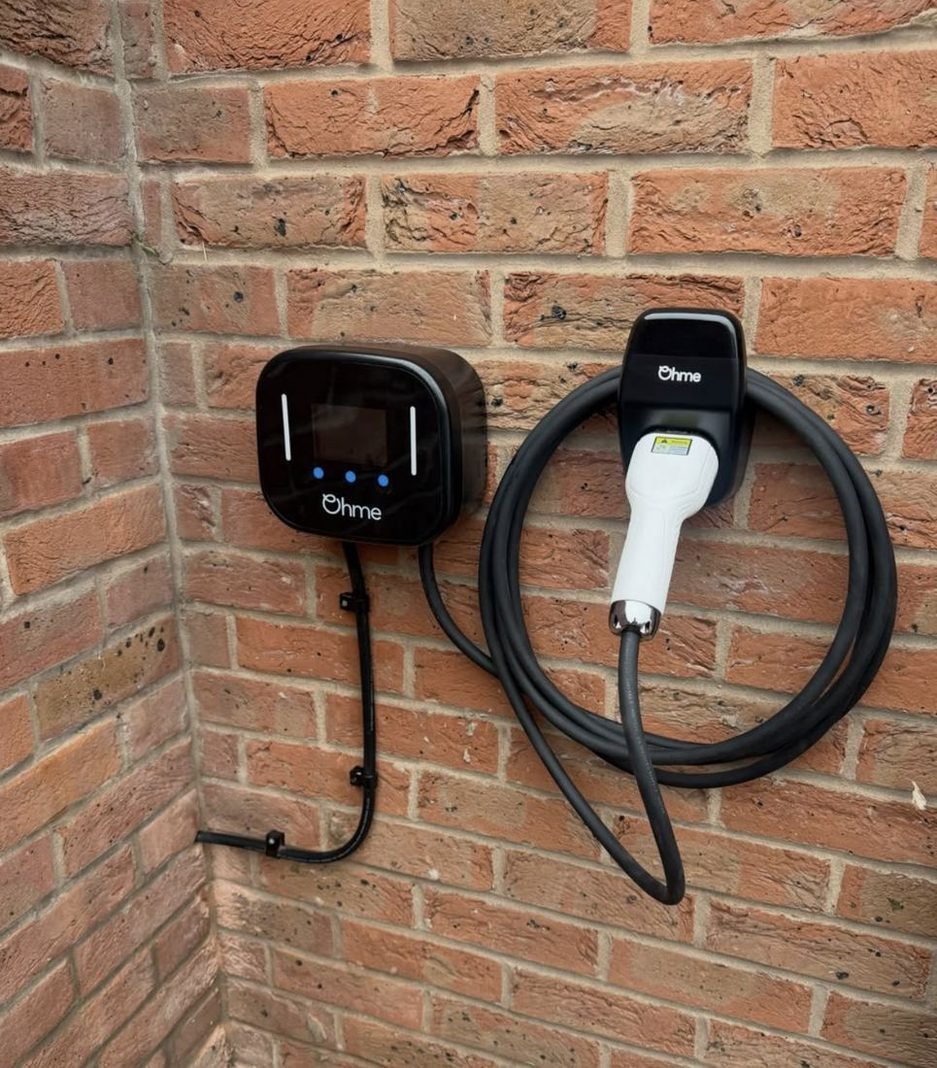 EV charger on a brick wall